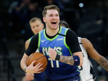 Dallas Mavericks guard Luka Doncic (77) reacts to a play during the second half of an NBA basketball game against the San Antonio Spurs in San Antonio, Wednesday, Feb. 26, 2020. (AP Photo/Eric Gay)