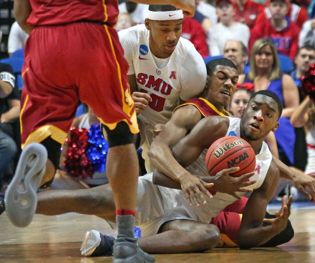 SMU guards Shake Milton (1), right, and Jarrey Foster (10), battle for a loose ball with USC...
