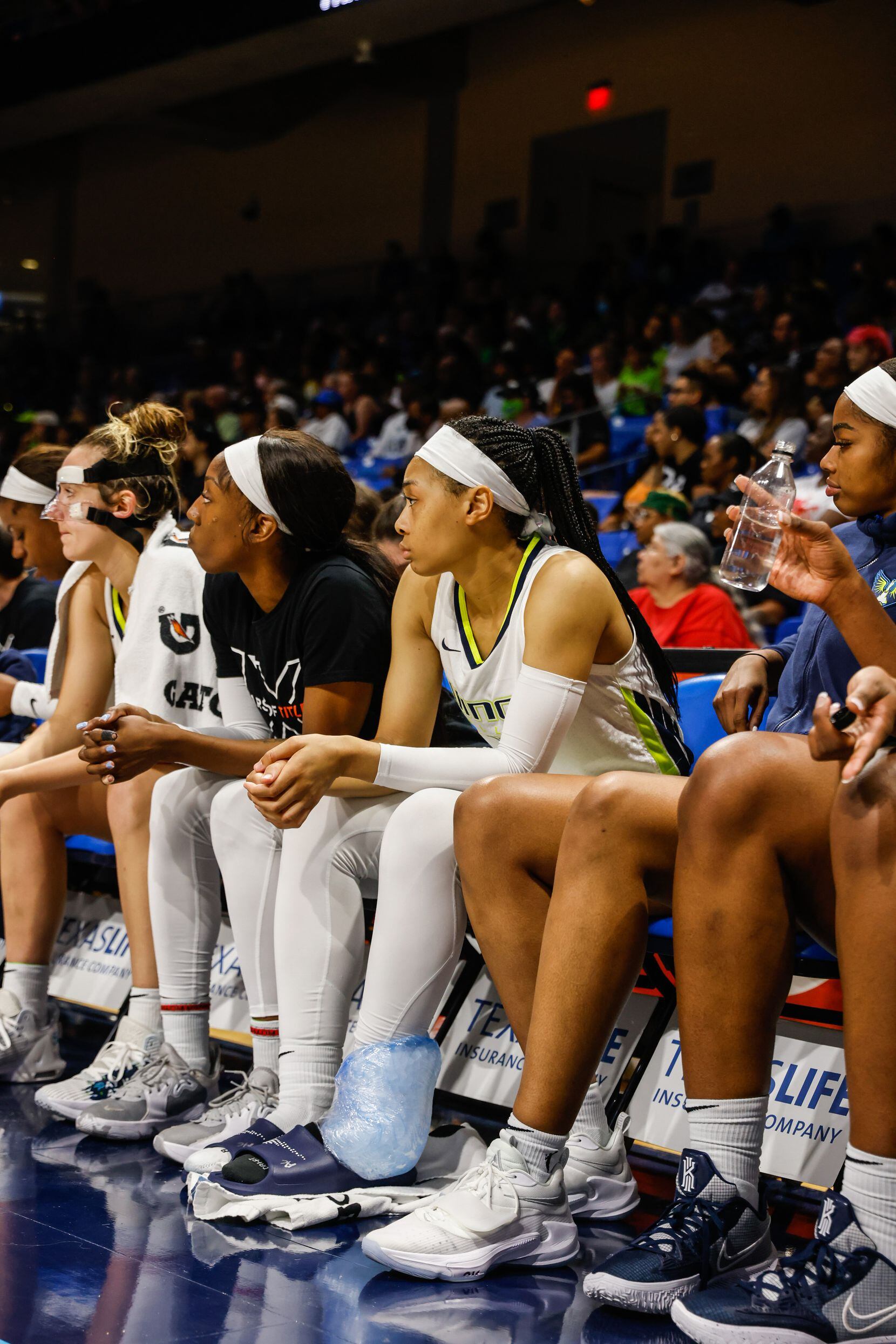 Dallas Wings guard Allisha Gray (15) ices her ankle during the second half at the College...