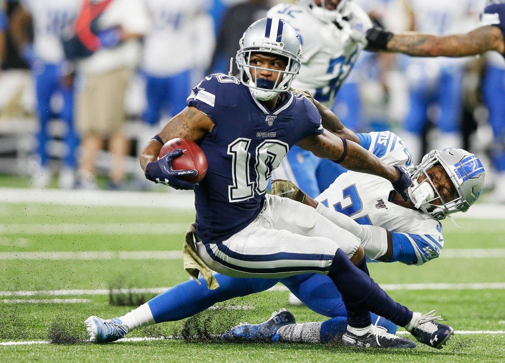 Dallas Cowboys wide receiver Tavon Austin (10) stiff arms Detroit Lions defensive back Dee Virgin (30) during the first half of play at Ford Field in Detroit, on Sunday, November 17, 2019. (Vernon Bryant/The Dallas Morning News)
