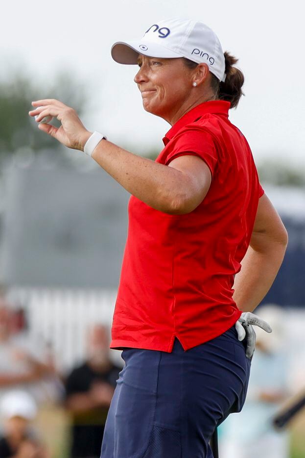Professional golfer Angela Stanford reacts after her final putt on the No. 18 green at the...