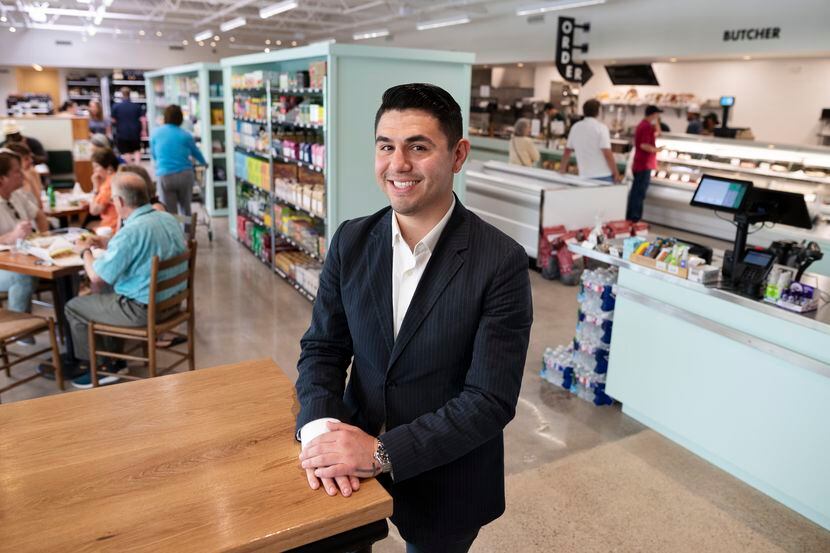 Chris Reale, owner and operator of the newly renovated Roy Pope Grocery, poses in sitting...