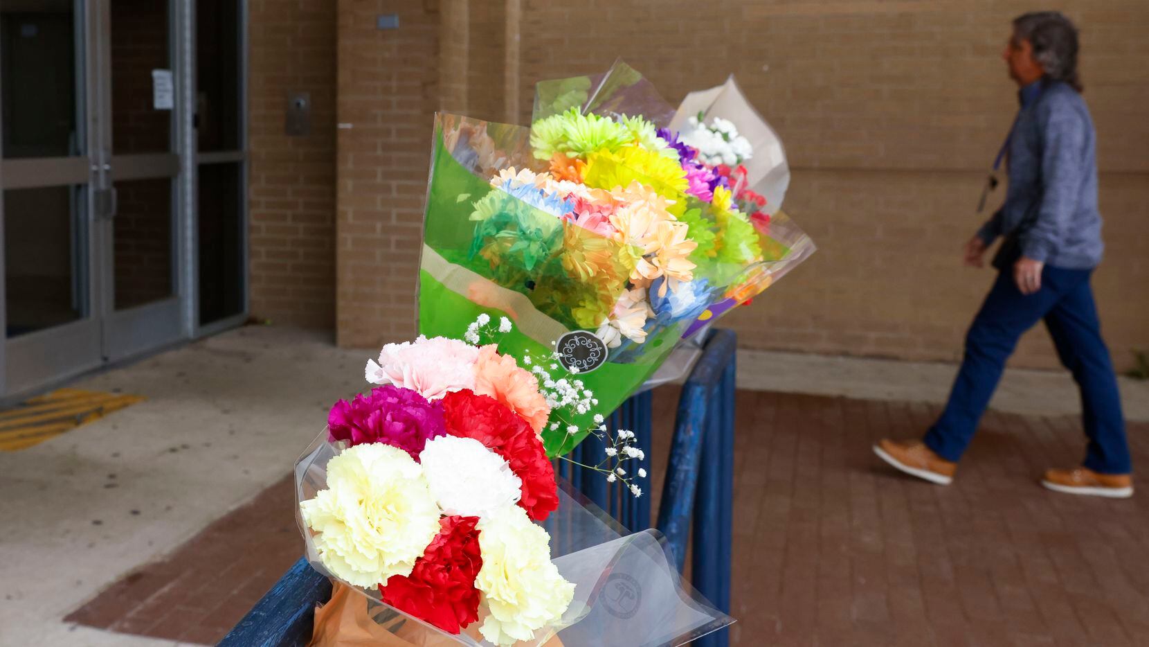 Flowers were placed at the front entrance of Lamar High School on Tuesday, a day after one...
