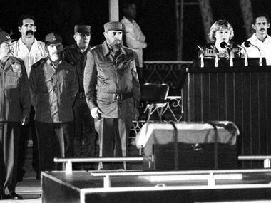 In this July 12, 1997 photo, Raul Castro, from left, Ramiro Valdes, and Fidel Castro stand...