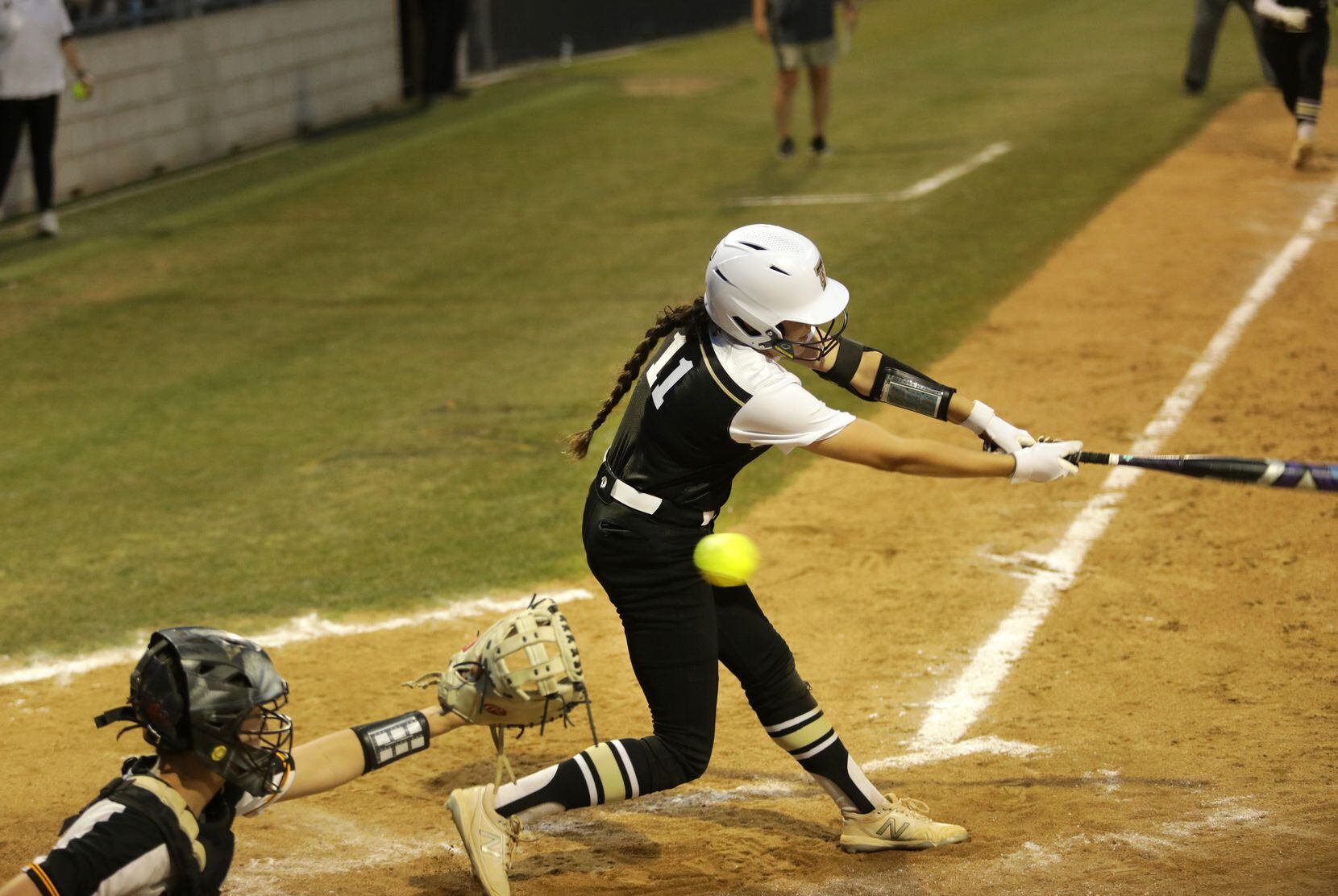The Colony High School #11, Olivia Wick, gets a strike during a softball game against Frisco...