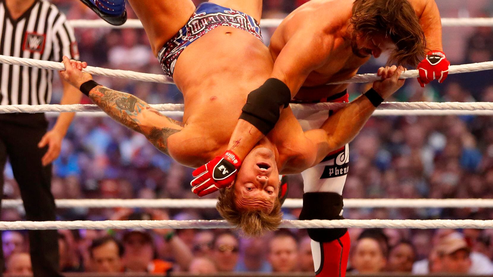 AJ Styles (right) wrestles with Chris Jericho during WrestleMania 32 at AT&T Stadium in Arlington in April.