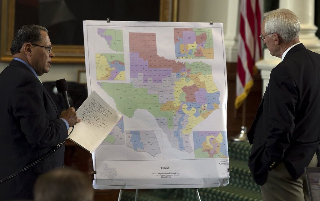 Sen. Jose Rodriguez, left, and Sen. Steve Ogden are shown in front of a map showing U.S....