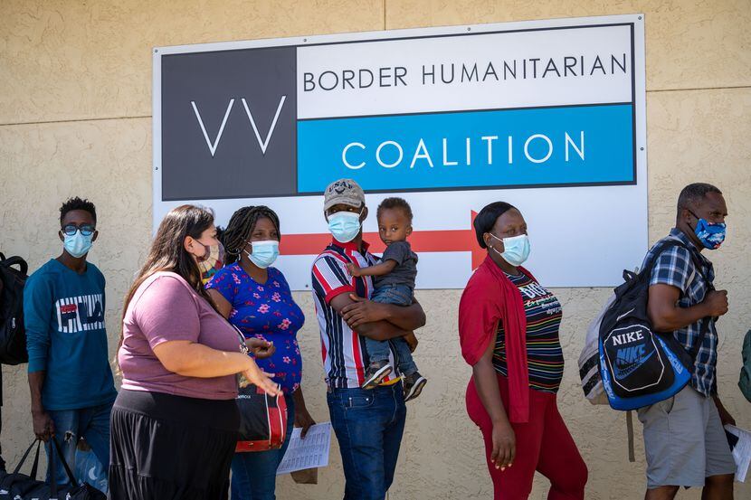 Migrants are greeted Lupita De La Paz at the Del Rio day shelter run by the Val Verde Border...