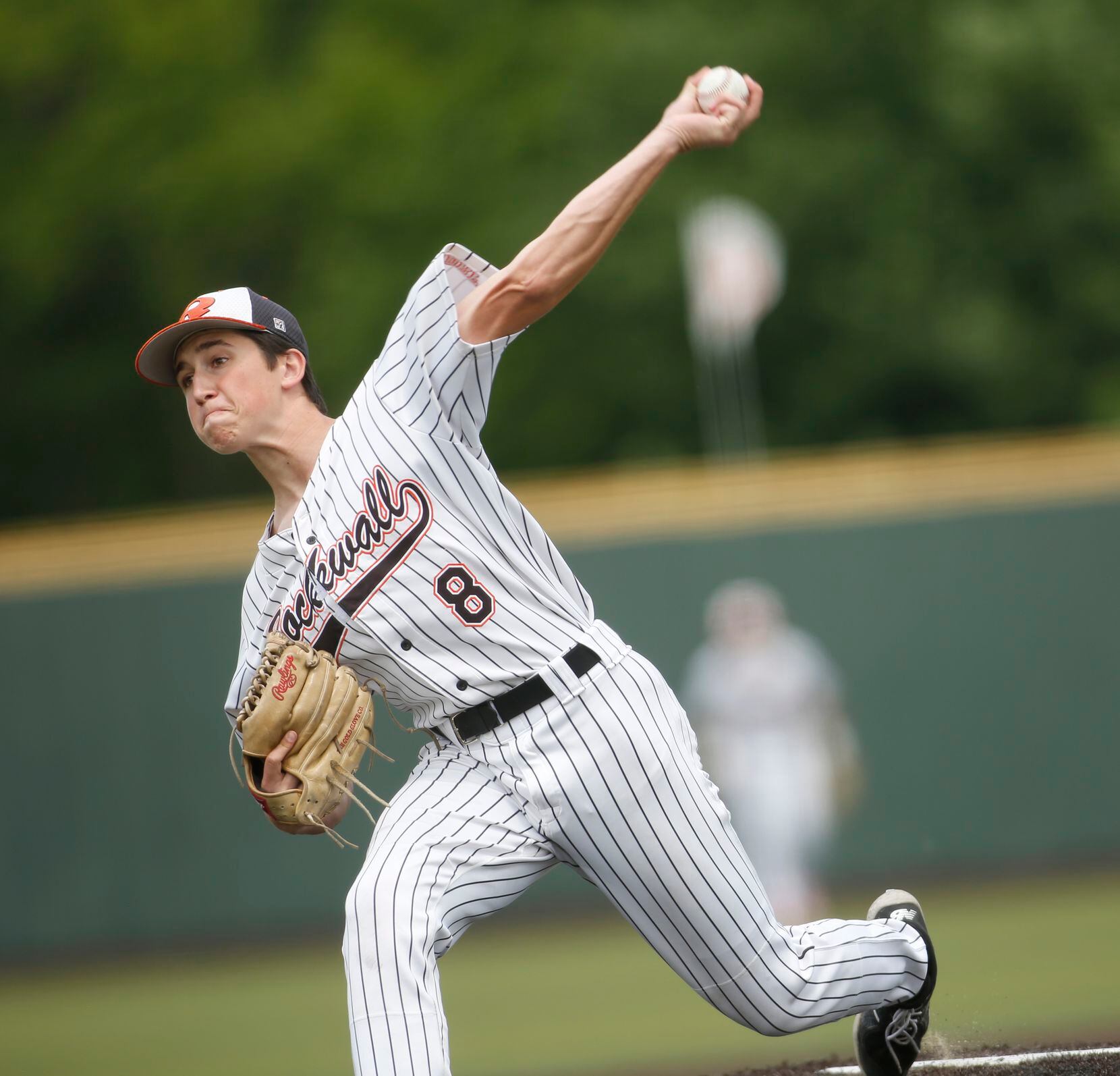 Rockwall pitcher Cade Crossland (8) delivers a pitch during the bottom of the 5th inning of...
