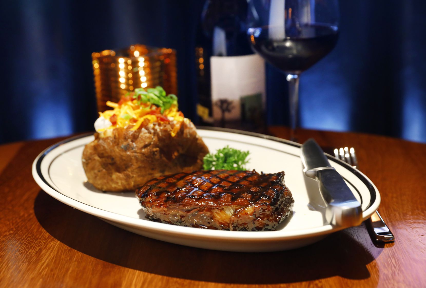The San Francisco rib-eye at Brentwood comes with a baked potato, a throwback side that is...
