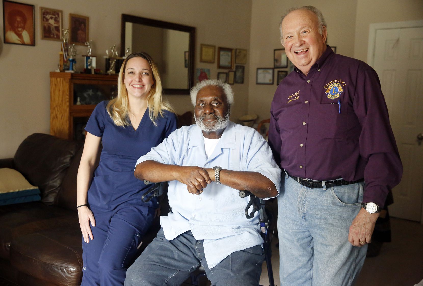 Meals on Wheels recipient George Kelley, 74, along with Abby Tupper and her father, Charlie,...