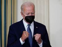 President Joe Biden reacts as House Majority Whip Rep. James Clyburn, D-S.C., speaks before...