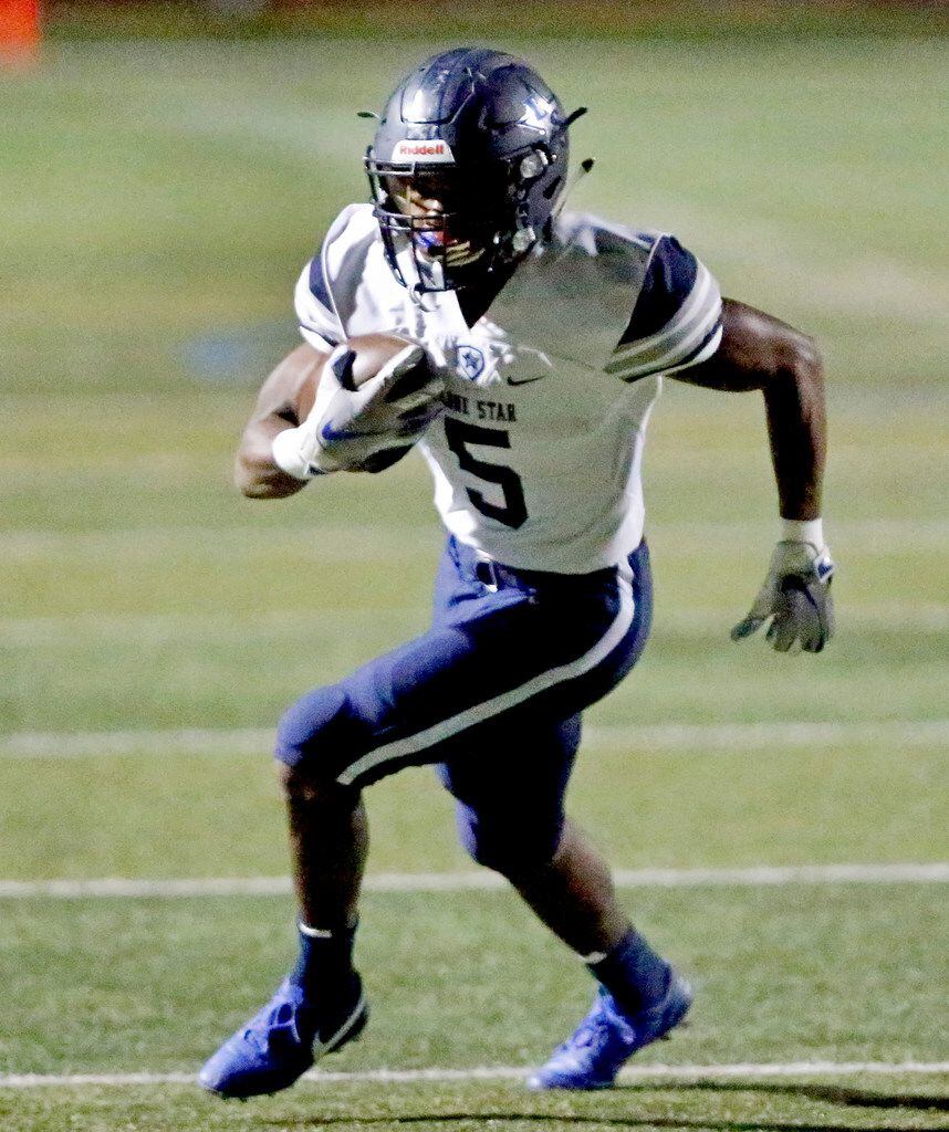 Lone Star High School running back Jaden Nixon (5) carries the football for a touchdown...