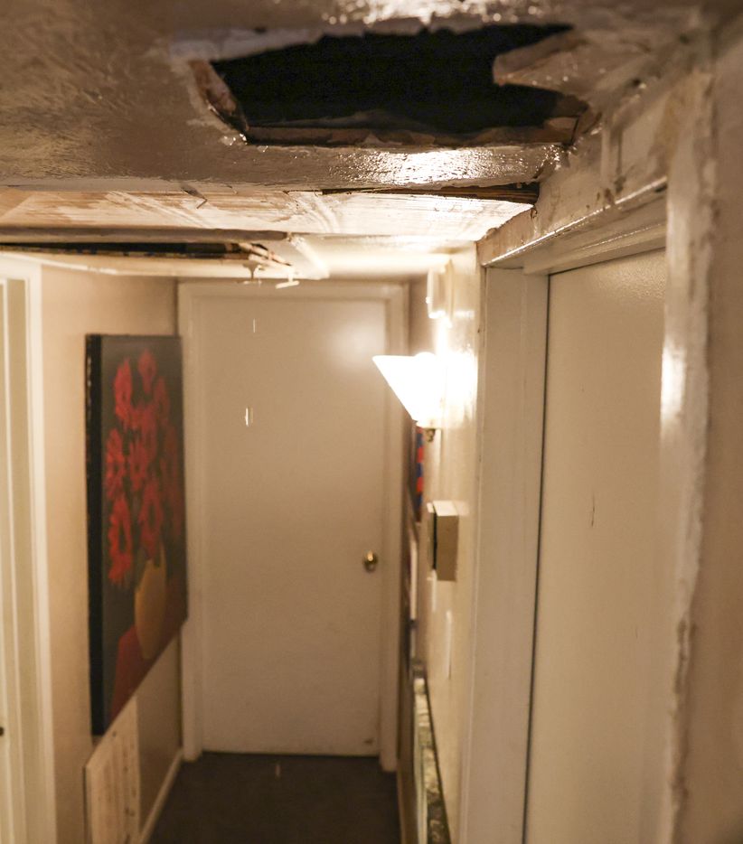 Water leaks from a hole in the ceiling of Brittany Jones’ apartment on Wednesday, May 11,...