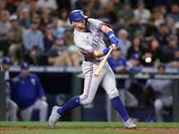Texas Rangers' Josh Jung hits a three-run home run on a pitch from Seattle Mariners' Diego...