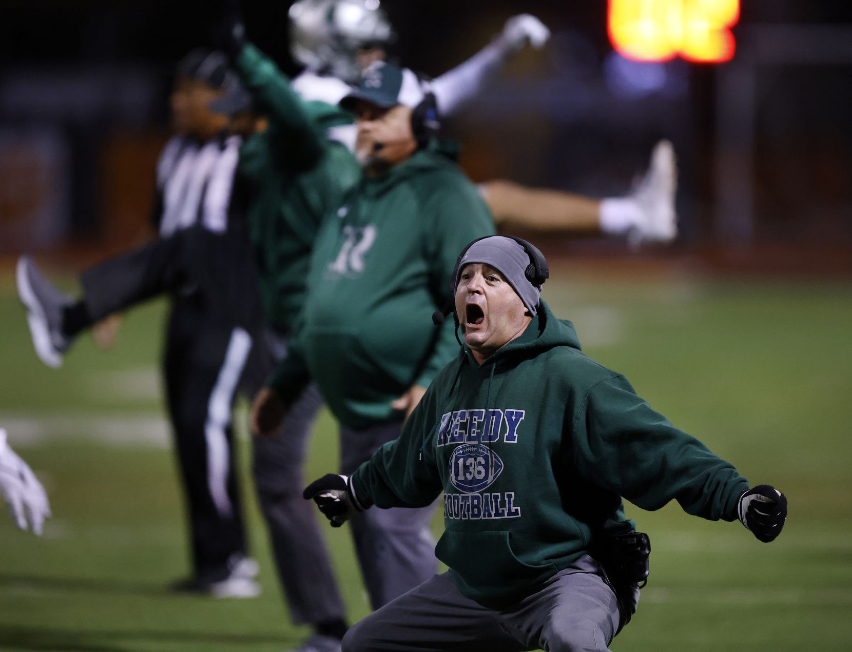 The Frisco Reedy defensive coordinator Brad Lagrone celebrates a stop of the Lancaster...