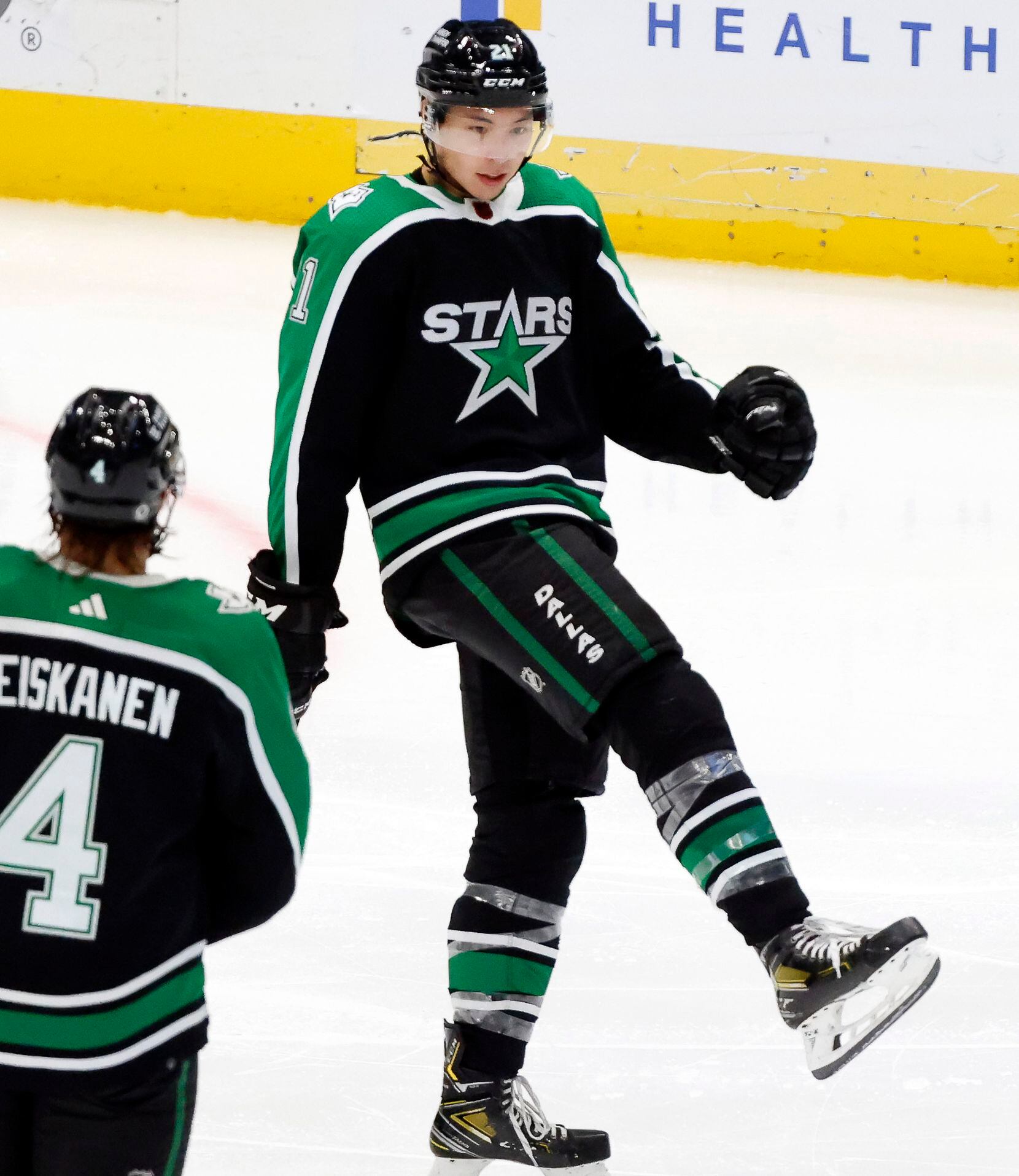 Dallas Stars left wing Jason Robertson (21) reacts after scoring a hat trick against the...