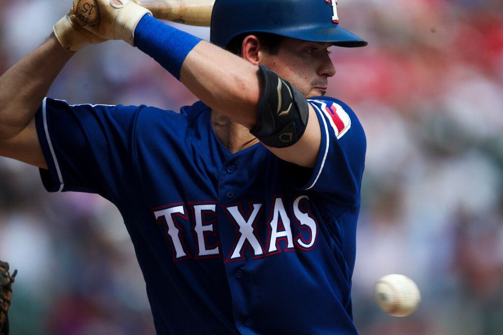 Texas Rangers second baseman Nick Solak (15) watches a pitches pass by during a MLB game...