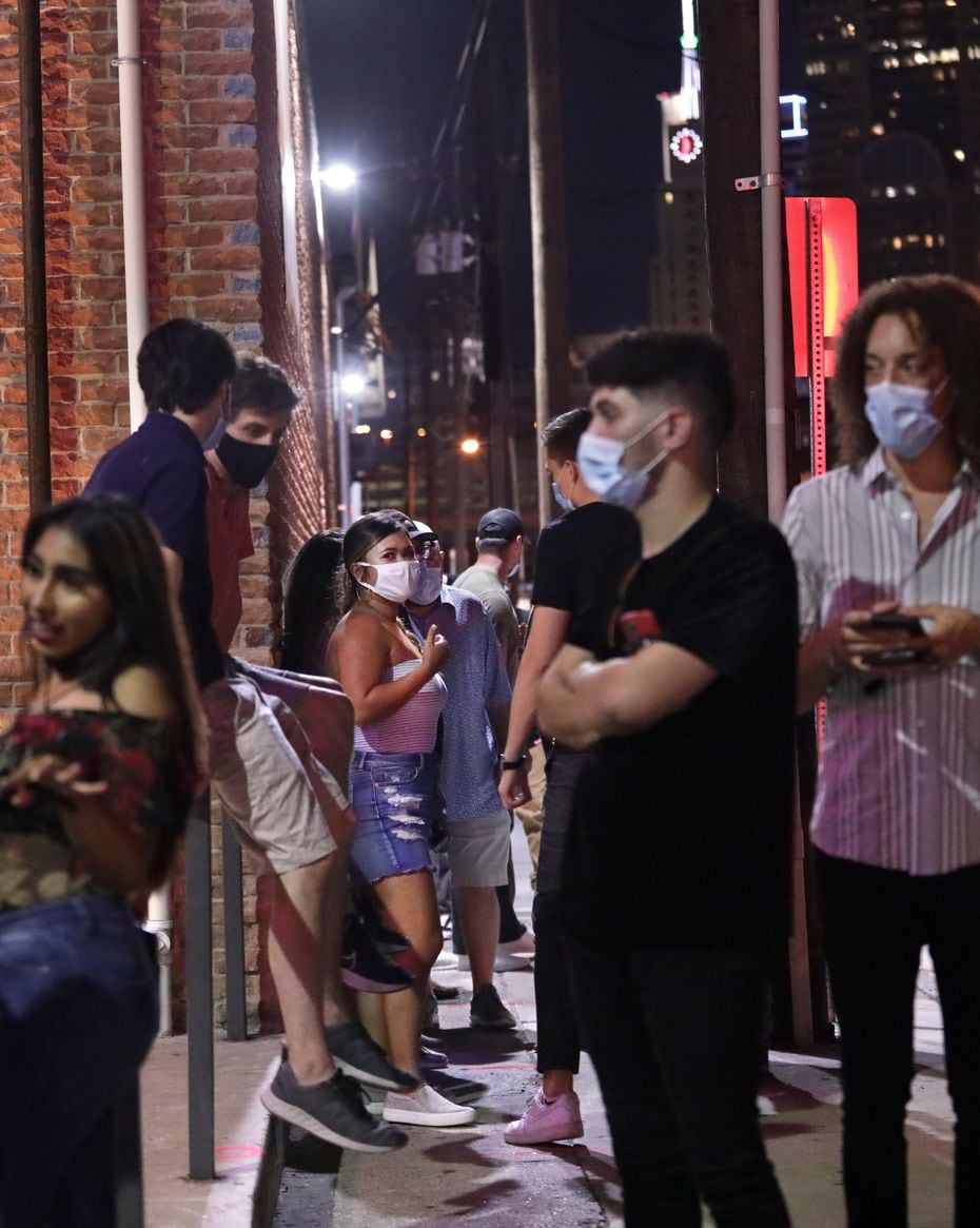 On the last weekend in August 2020, patrons at Bottled Blonde wait to get inside the venue. Some wore masks, some didn't.