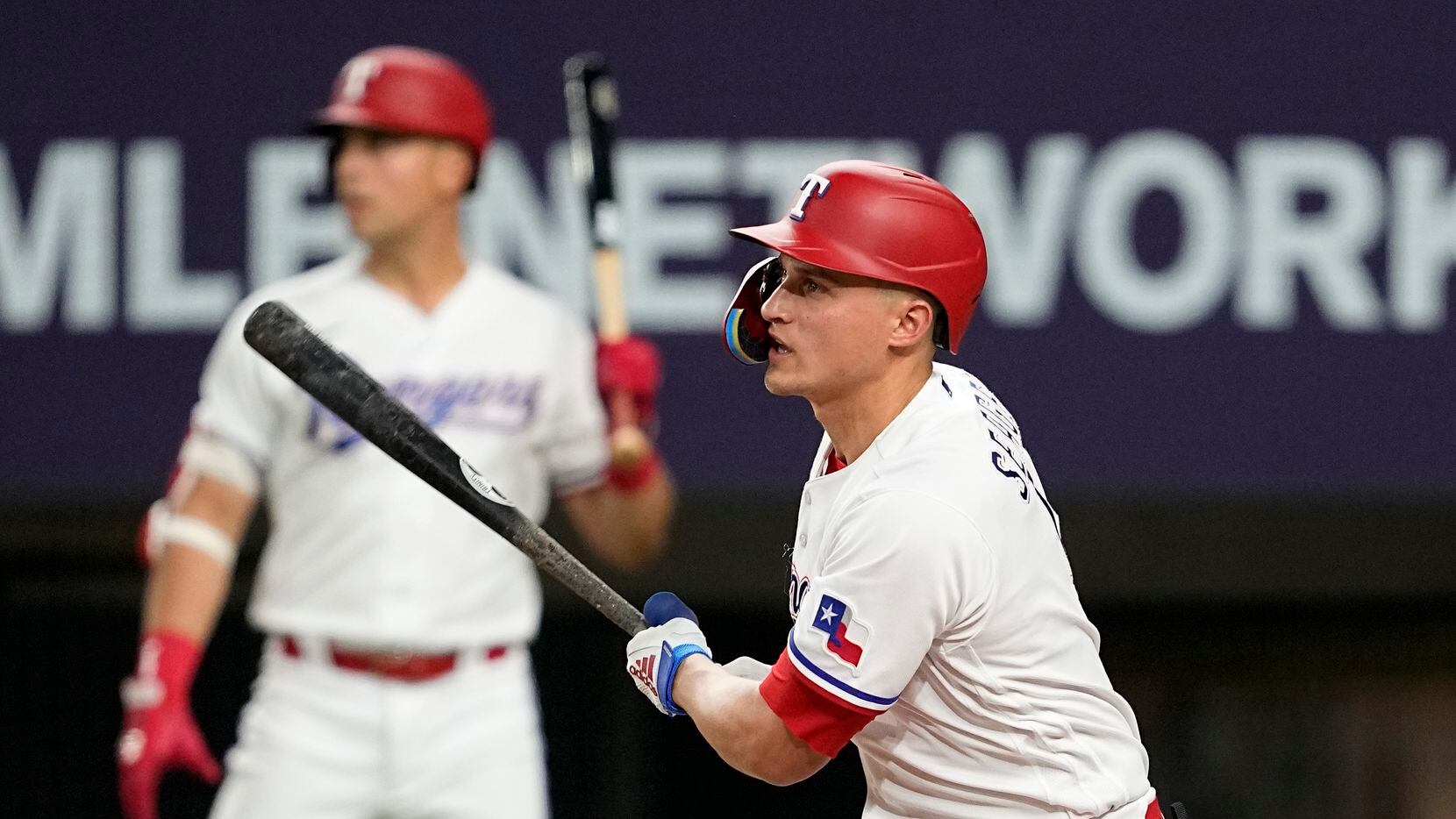 Texas Rangers' Corey Seager watches his RBI sacrifice fly against the Atlanta Braves during...