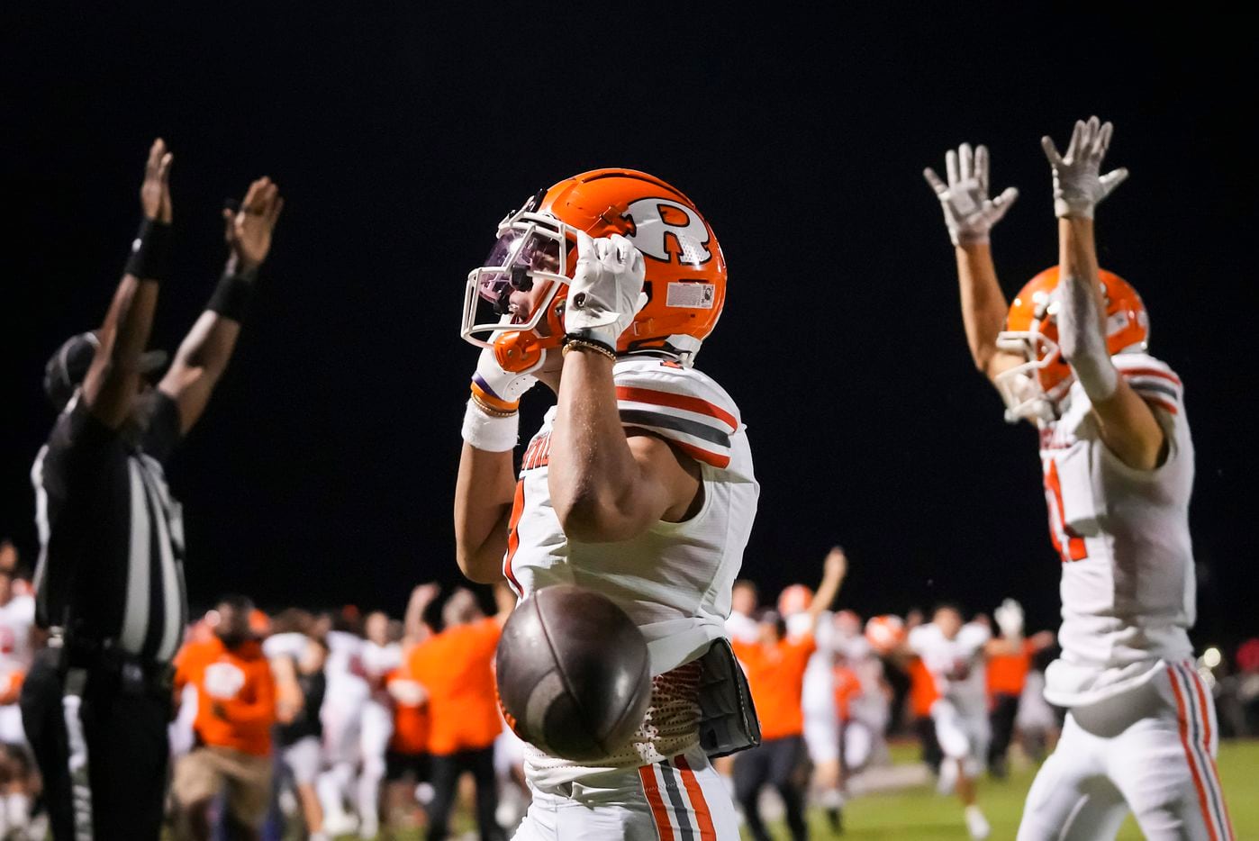 Rockwall wide receiver Aiden Meeks (1) celebrates after he caught tipped ball on a hail mary...