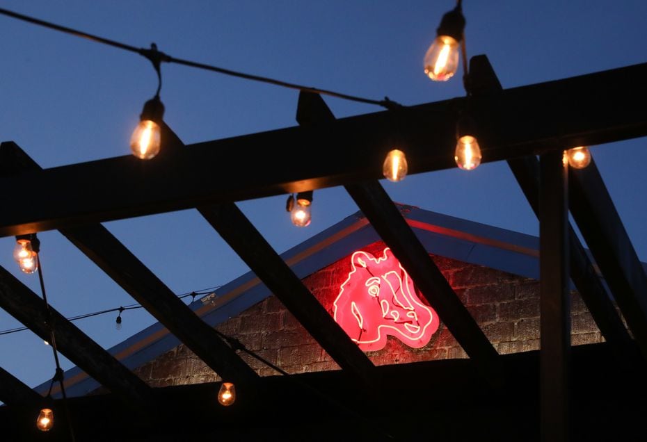Customers walking or driving by will see the red neon horse head hanging above Goodbye...