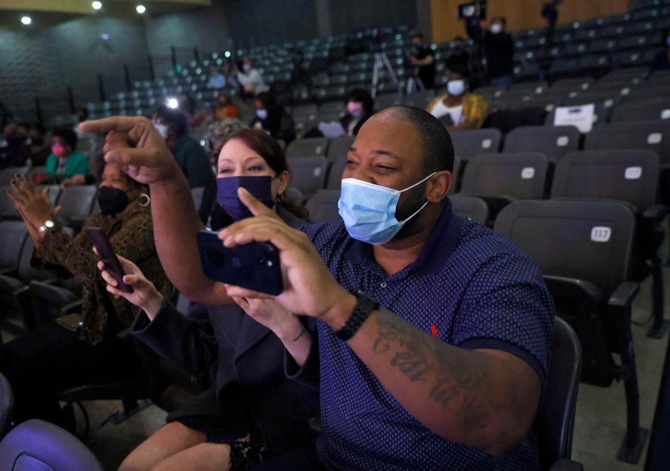 Tristan Whitfield Sr (right) and his wife Rebecca (second from right) react after their...