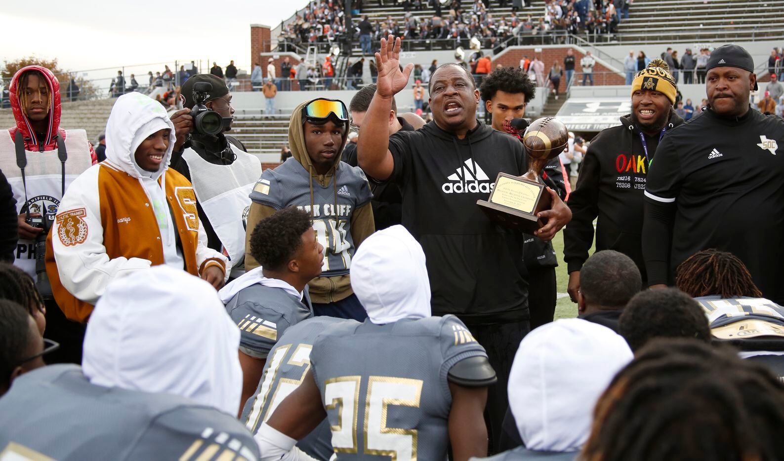 South Oak Cliff head coach Jason Todd speaks with his players after being presented the Class 5A Division ll Regional Championship trophy following the team's 33-28 victory over Aledo to advance. The two teams played their Class 5A Division ll Region ll semifinal football game at Vernon Newsom Stadium in Mansfield on November 26, 2021. (Steve Hamm/ Special Contributor)