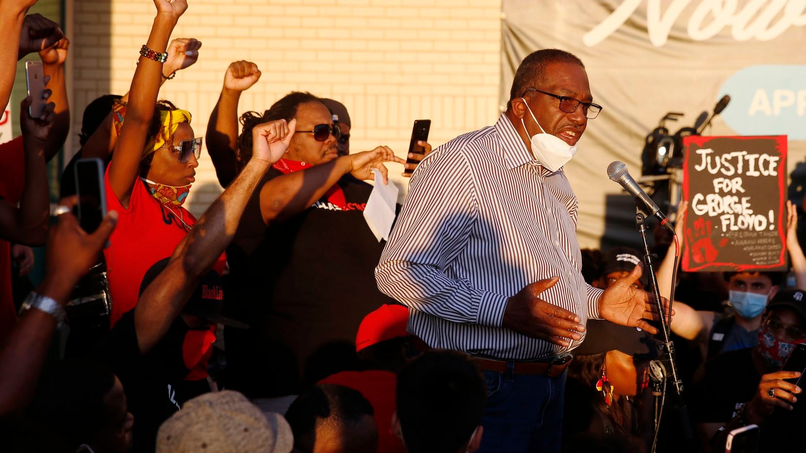 Texas Senator Royce West speaks to protesters during a demonstration against police...