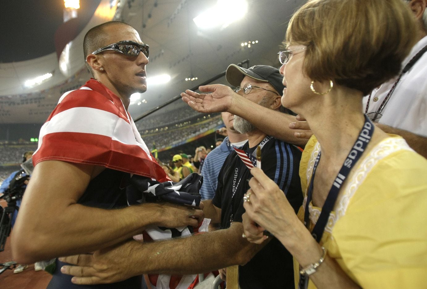 2008 Beijing Olympics: Silver medalist Jeremy Wariner gets consoling hugs from his mother...