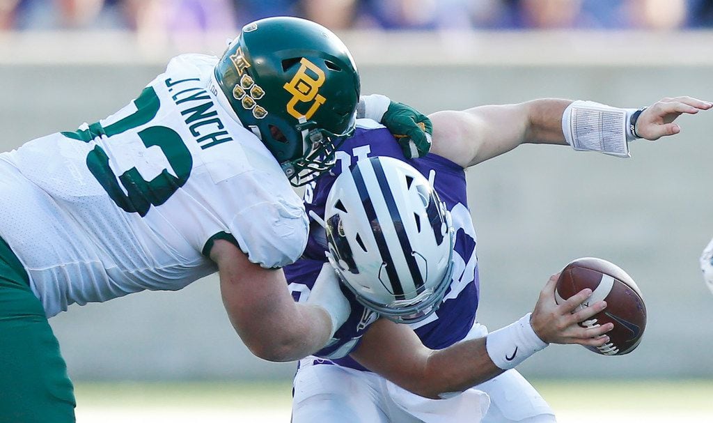 Baylor defensive tackle James Lynch (93) drags down Kansas State quarterback Skylar Thompson (10) in the fourth quarter at Snyder Family Stadium in Manhattan, Kan., on Saturday, Oct. 5, 2019. Baylor won, 31-12.