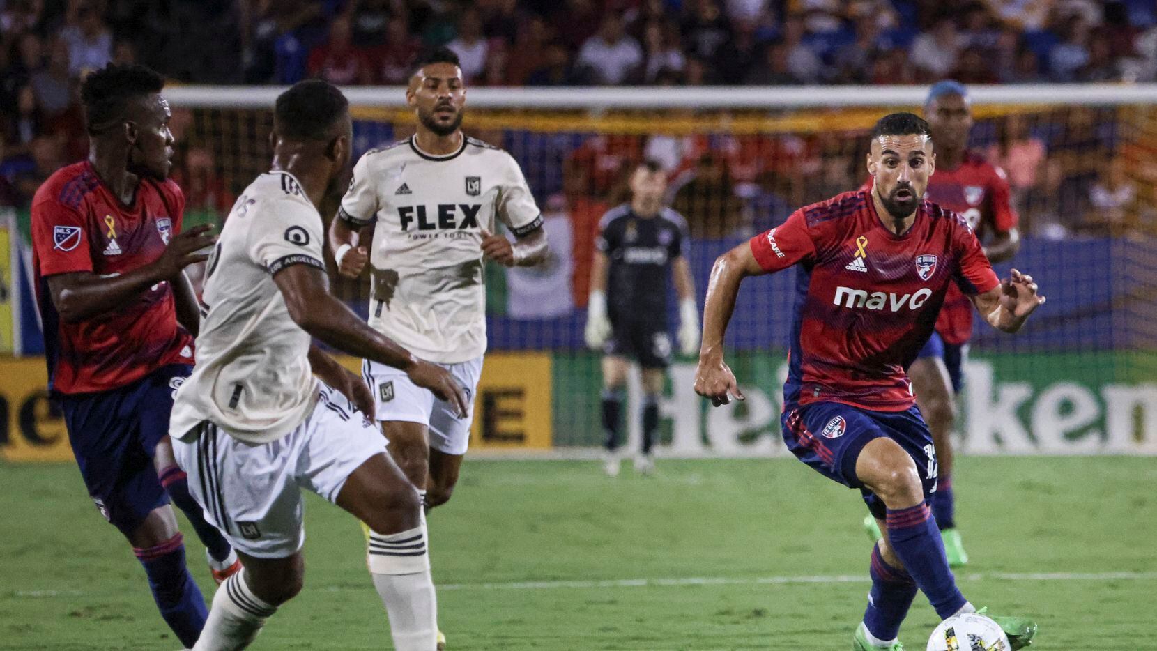 FC Dallas midfielder Sebastian Lletget (12) dribbles the ball up the field during the game...