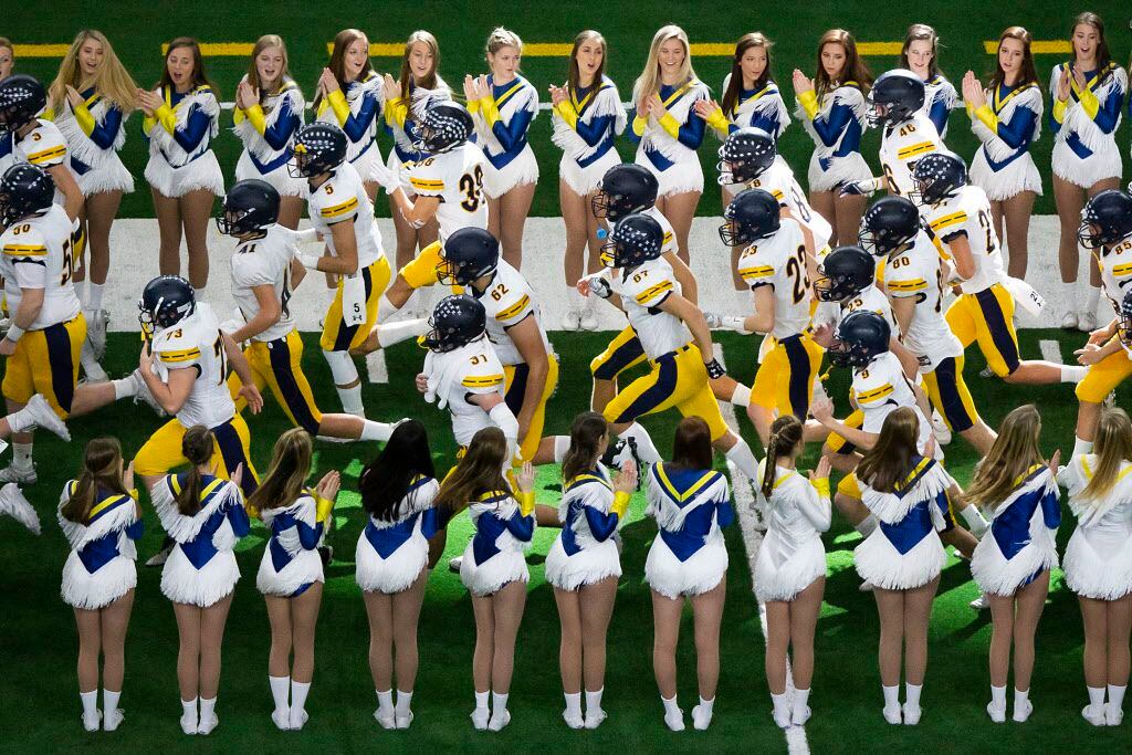Highland Park players take the field before a Class 5A Division I state semifinal state...