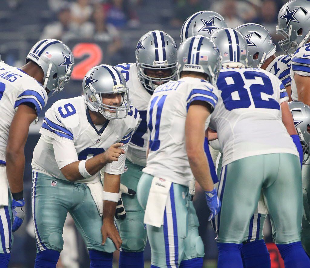Dallas Cowboys quarterback Tony Romo (9) speaks in the huddle in the first quarter during a...