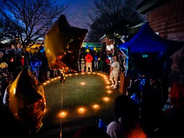 Jennifer Edwards speaks during a vigil for Marc "Flea" Strickland, an 18-year-old victim of a shooting at Dallas ISD basketball game, at Bushman Park on Sunday, Jan. 19, 2020.