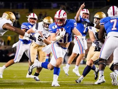 SMU running back Tyler Lavine (31) gets past Navy cornerback Cameron Kinley (3) for a touchdown during the second quarter of an NCAA football game at Ford Stadium on Saturday, Oct. 31, 2020, in Dallas.
