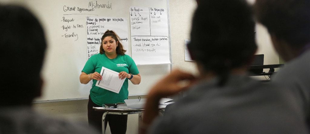 Amanda Mendoza talks with students during a 2017 sex education class in Vickery Meadows in...