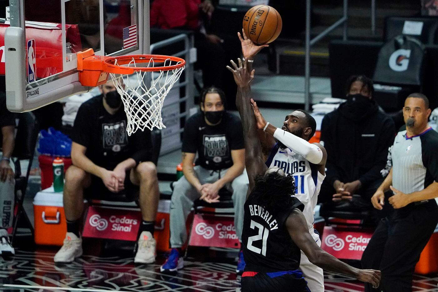 Dallas Mavericks forward Tim Hardaway Jr. (11) shoots over LA Clippers guard Patrick Beverley (21) during the second half of an NBA playoff basketball game at Staples Center on Tuesday, May 25, 2021, in Los Angeles. The Mavericks won the game 127-121.