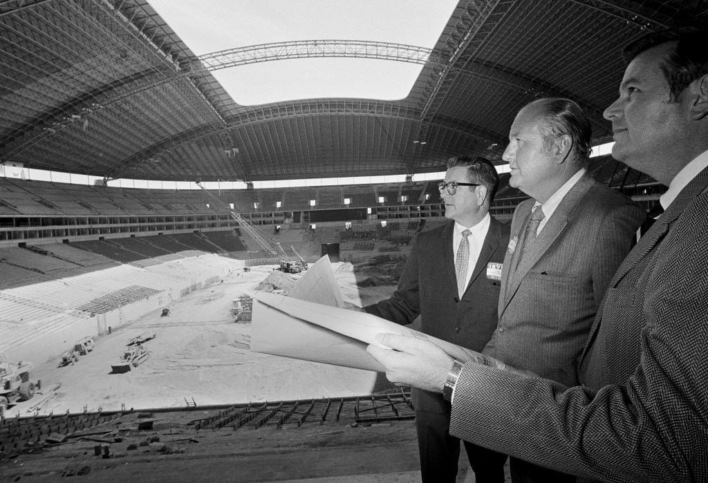 Dallas Cowboys owner Clint Murchinson, left, general manager Tex Schramm, center and Irving...