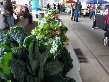 Denton Creek Farm's table is full of kale, chard, beets and more at the Dallas Farmers Market.
