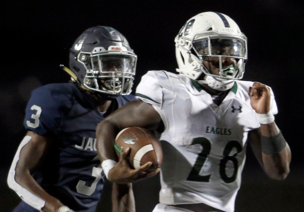 Prosper running back JT Lane (28) is "off to the races" as he scampers past the defensive...