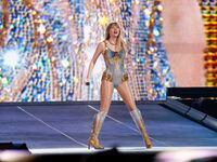 Taylor Swift performs during the Eras Tour concert at AT&T Stadium in Arlington on Friday.