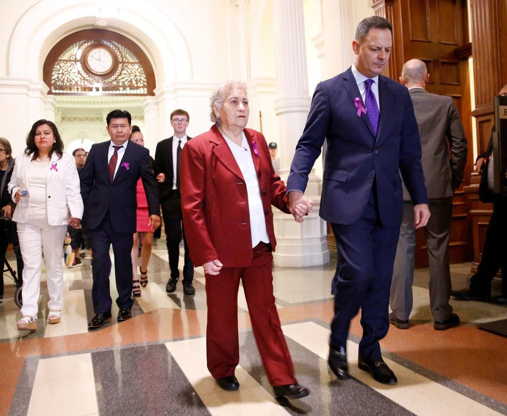 Rep. Rafael Anchia, D-Dallas, escorts Amparo Camacho, grandmother of Linda "Michellita"...
