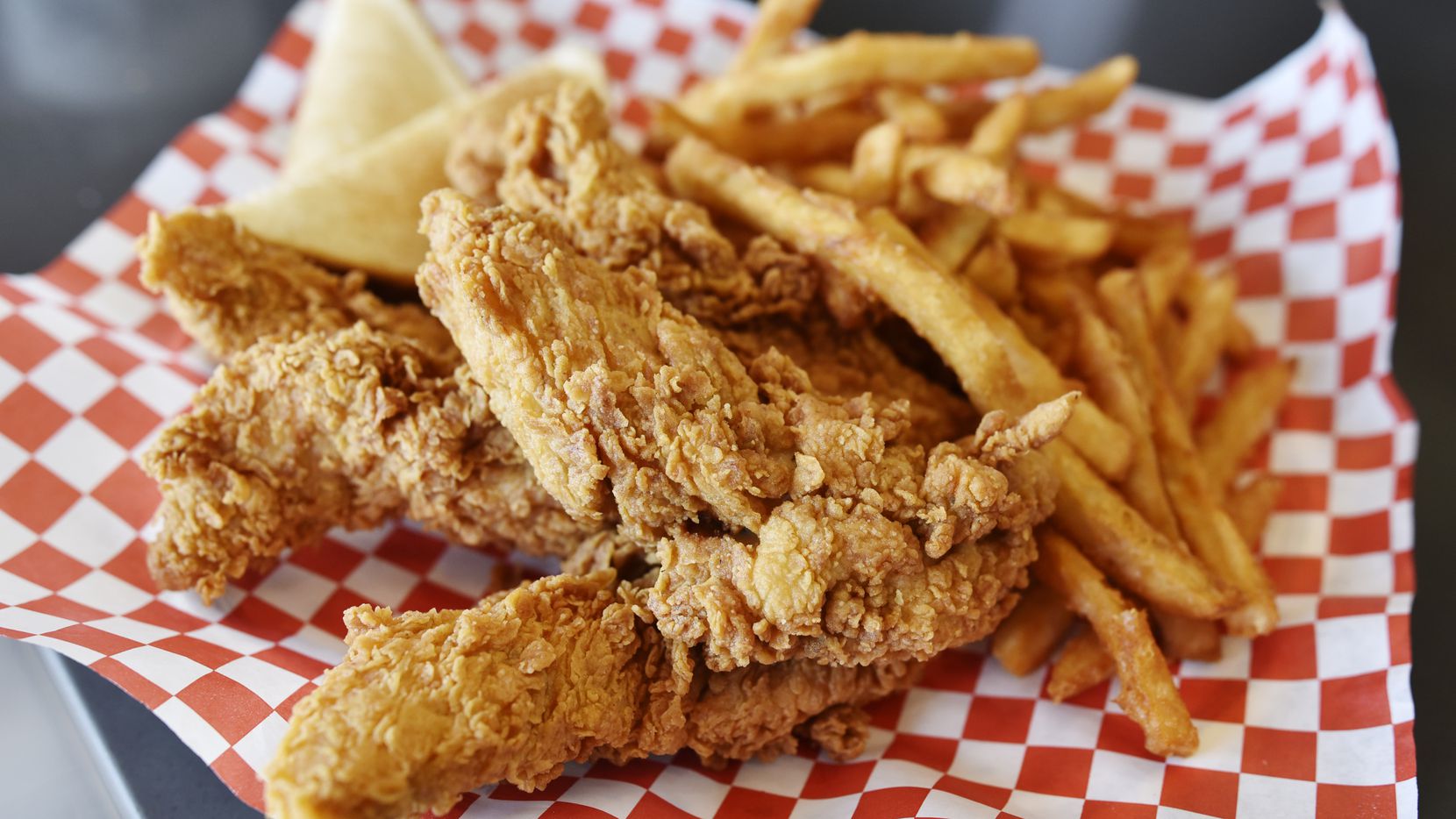 An order of chicken tenders, fries and toast from Mike's Chicken on Maple Avenue in Dallas....