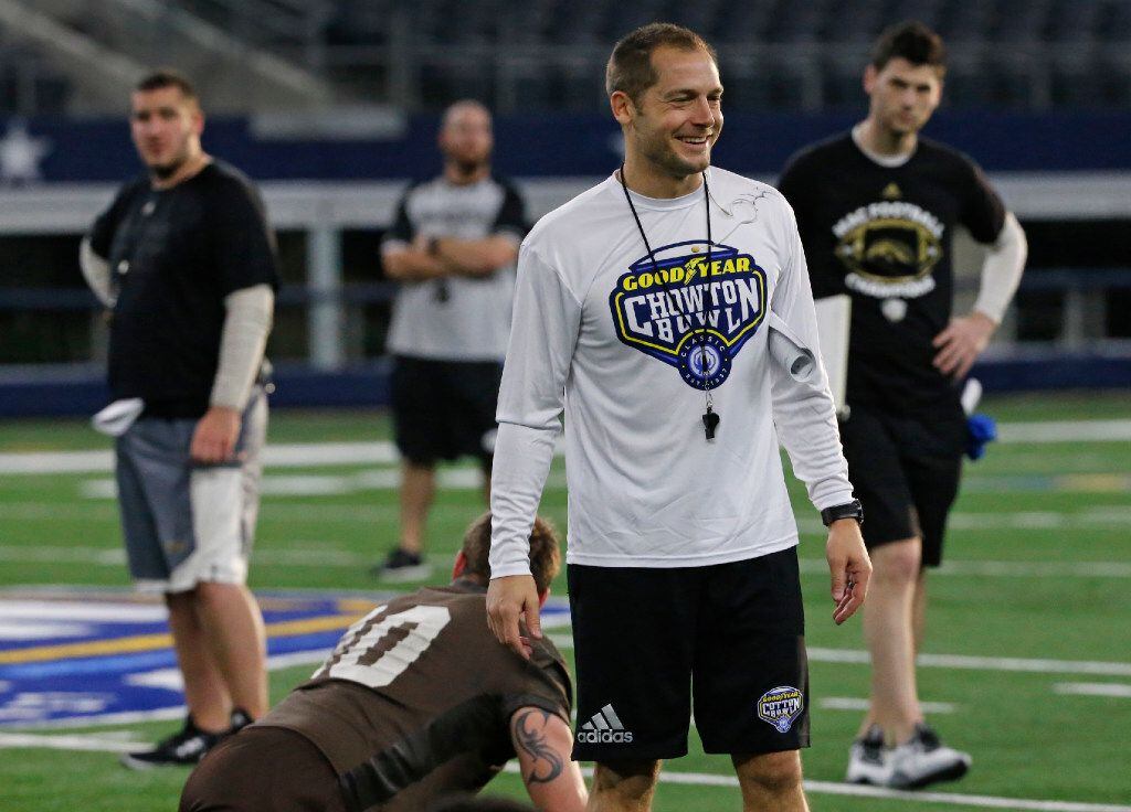 Western Michigan head coach PJ Fleck is all smiles as his team stretches during practice for...