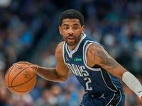 Dallas Mavericks guard Kyrie Irving looks to drive to the basket during the first half of an...