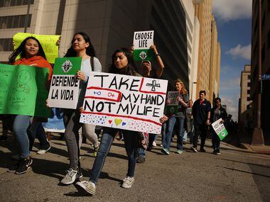 Marchers move through downtown during the North Texas March for Life in Dallas Saturday.  