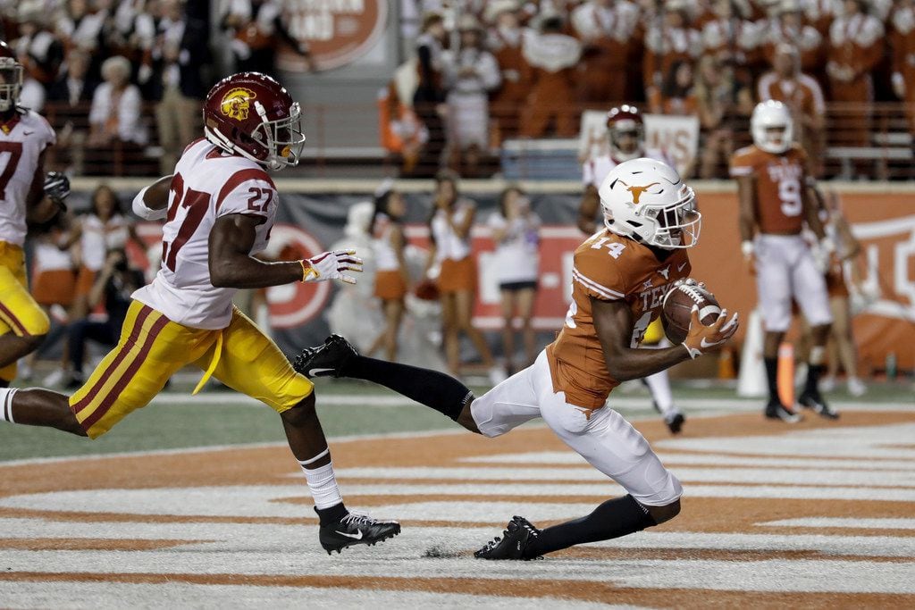 FILE - Texas receiver Joshua Moore hauls in a touchdown pass against USC last season. (Photo...