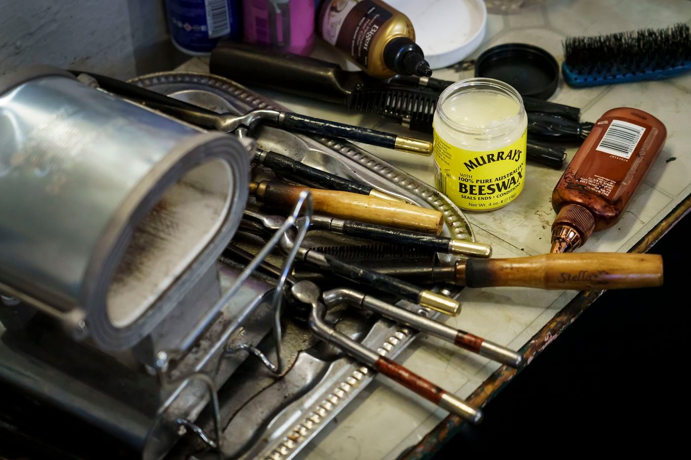 Earnestine Tarrant’s supplies and equipment are seen at her station in her hair salon in South Dallas on her final day working before her retirement.