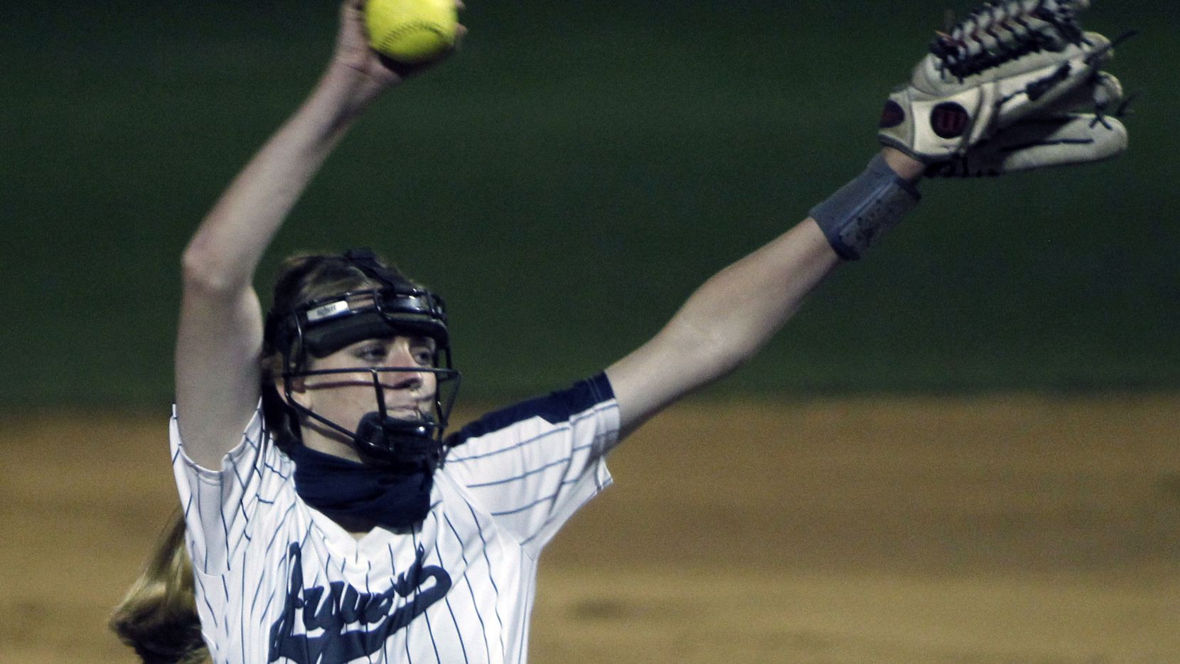 Flower Mound pitcher Landrie Harris (15) delivers a pitch to a Plano batter during the top...